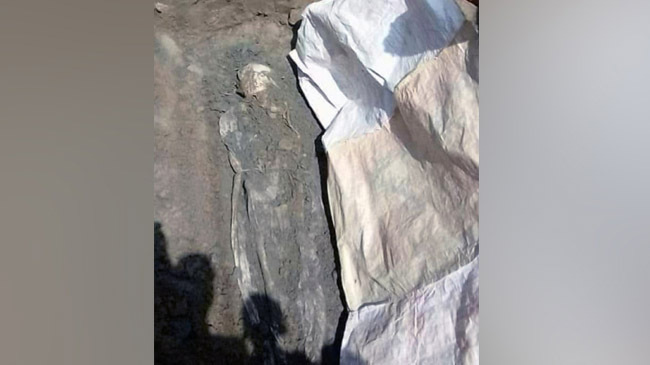 intact body in grave