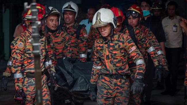 members of the fire and rescue department retrieved a died bangladeshi worker