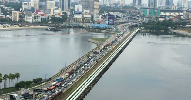 road on river deviding malaysia and singapore