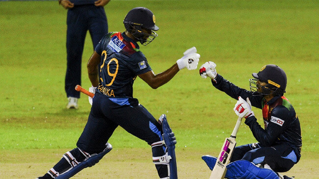 dhananjaya de silva and chamika karunaratne celebrate sri lankas win