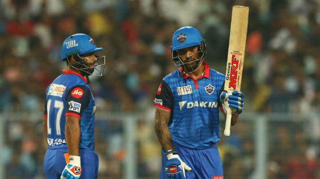 dhawan acknowledges the applause as pant looks on