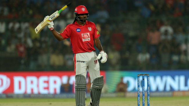 gayle raises his bat after reaching 50