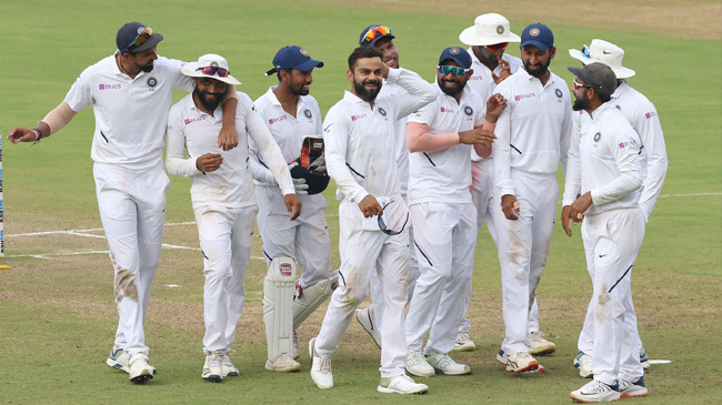 indian players celebrate their innings victory