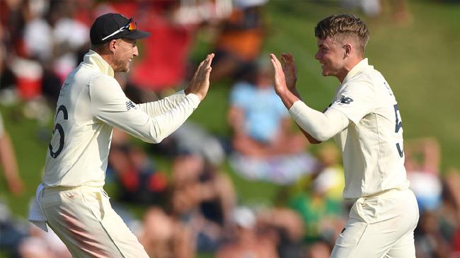 joe root and sam curran celebrate