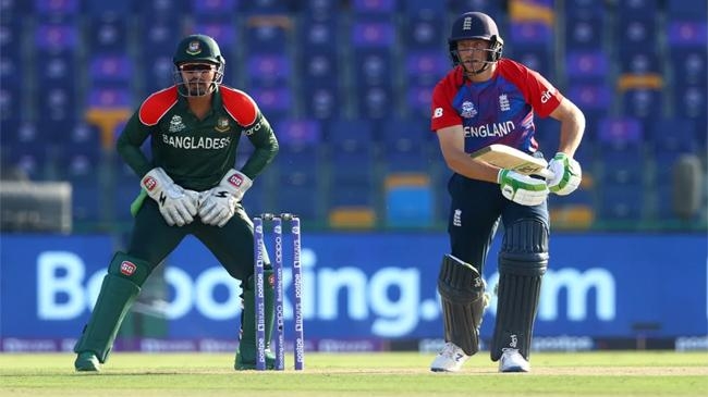 jos buttler bats with nurul hasan behind the poles