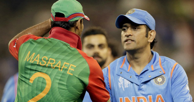 mashrafe holding cap while shaking hand with dhoni