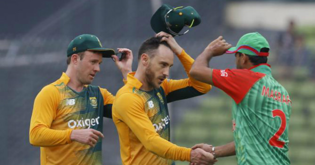 mashrafe holding cap while shaking hand with faf du plessis