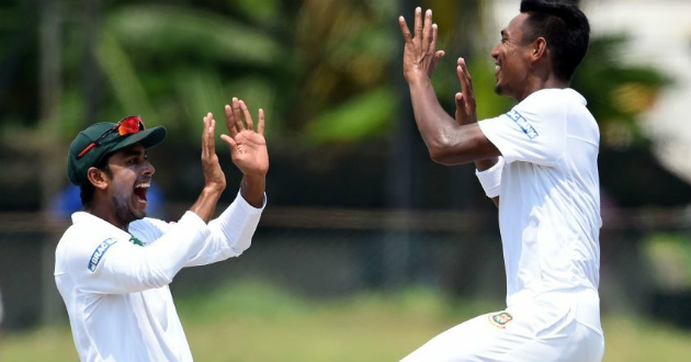 mustafiz and miraz celebrating a wicket