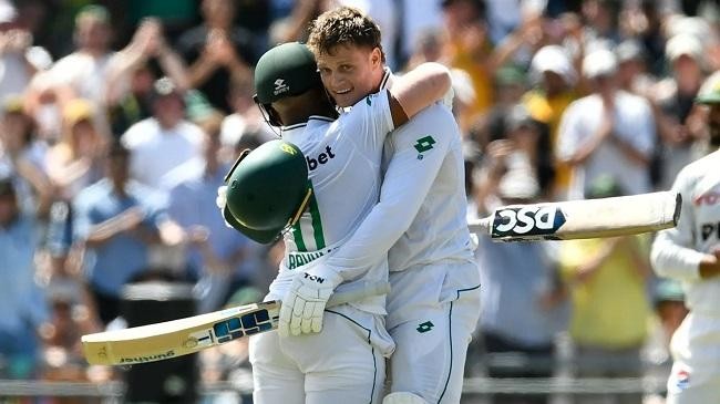 ryan rickelton gets a hug from temba bavuma