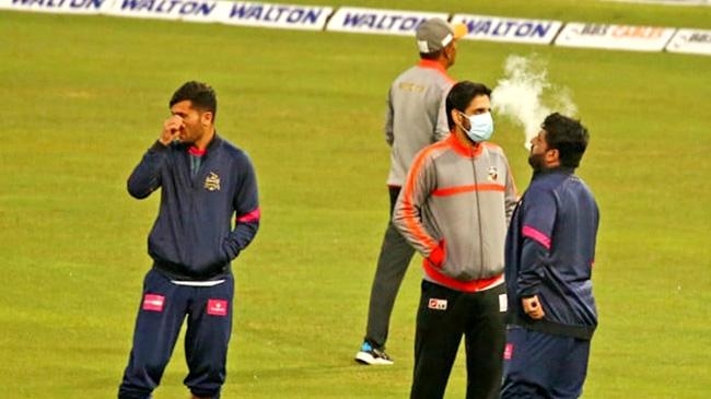 shehzad is smoking in the field