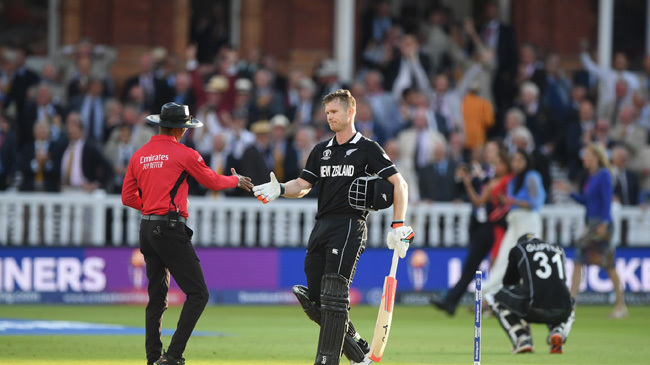 umpire kamar dharmasena shakes hands with jimmy neesham