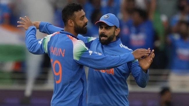 varun celebrates the wicket of will young with kohli