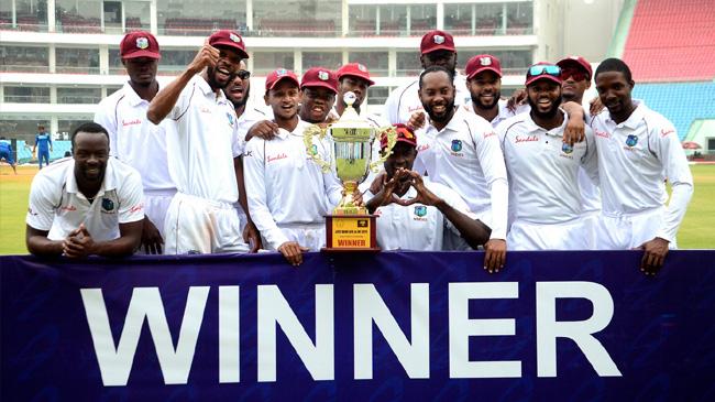 west indies players pose with the trophy