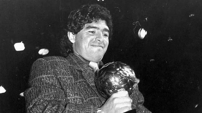 diego maradona with the golden ball trophy