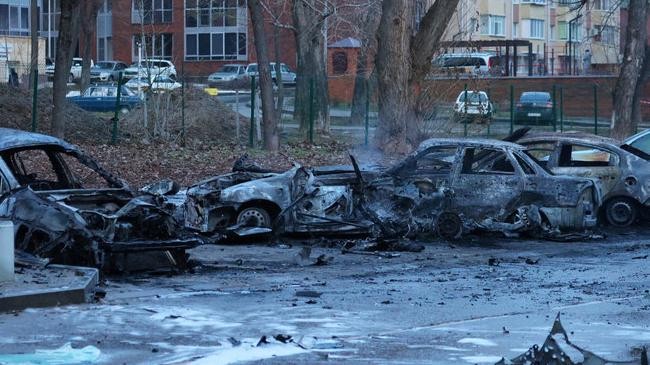 a view shows burned out cars