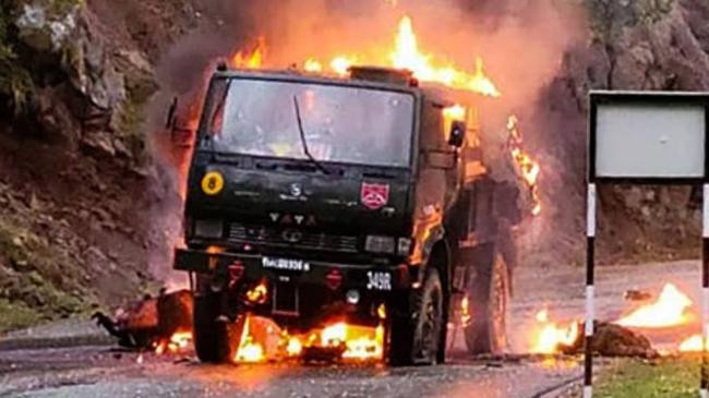 an army vehicle catches fire