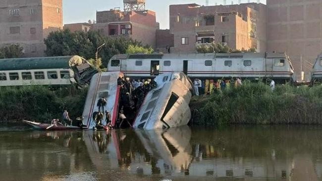 egypt train collision as carriages fall into canal