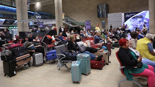 passengers wait in airport