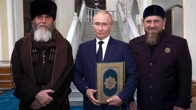 putin was presented with a copy of the quran while visiting a mosque in grozny with chechen leader kadyrov