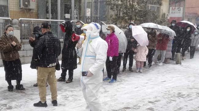 residents line up in the snow for covid 19 screening in jilin province