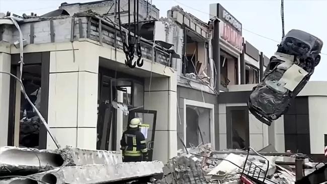 russian emergency ministry employees work at the side of a collapsed bakery in lysychansk