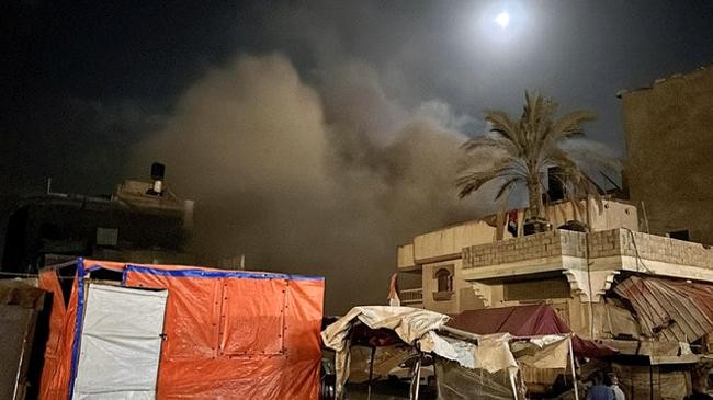 smoke rises after an israeli air strike on a house amid the israel hamas conflict in khan younis