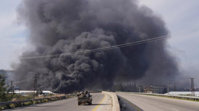 smoke rises in latakia syria