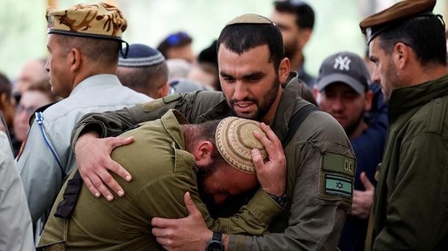 soldiers attend the funeral of captain liron snir