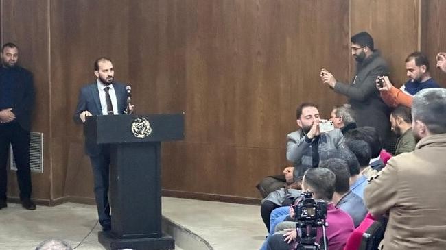 syrian minister of information mohamed al omar speaks to journalists