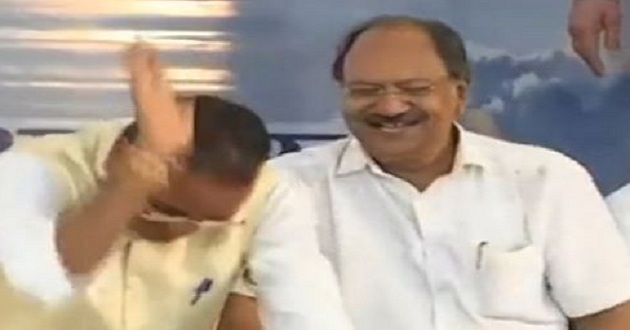 two ministers laughing a condolence meeting new