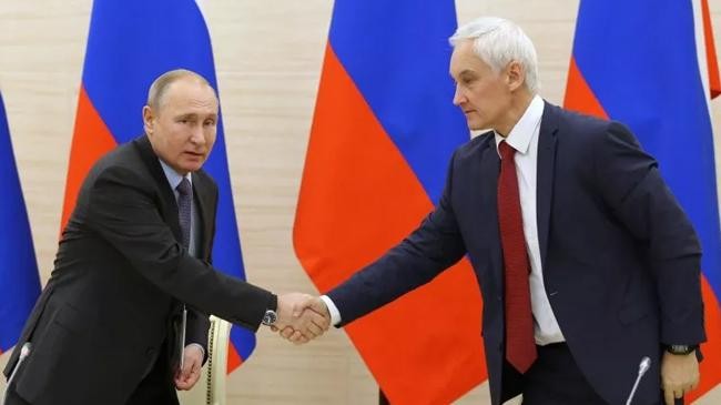 vladimir putin greets andrei belousov