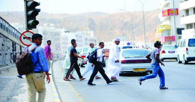 warning about crossing roads in oman